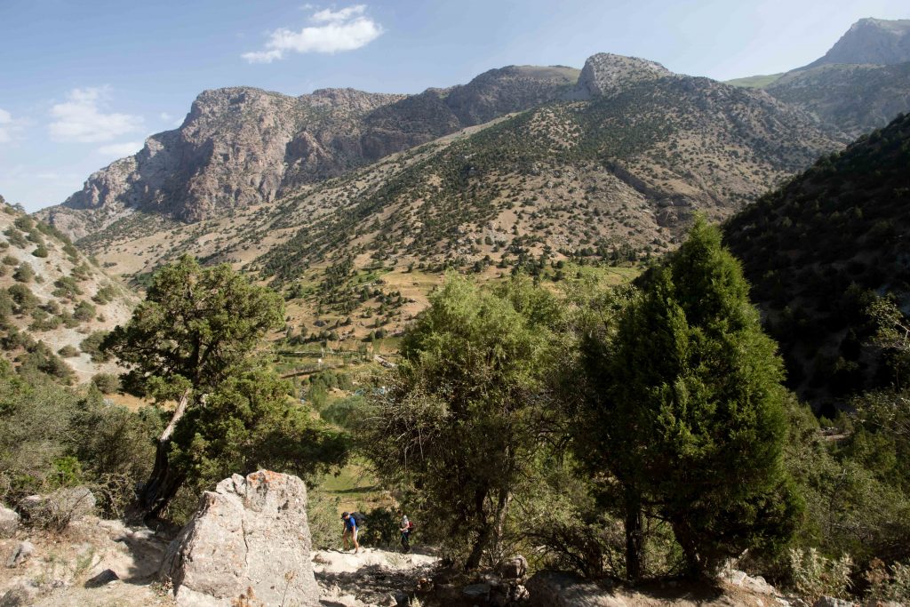 Hikers climb toward Chukurak Lake from Artuch Alplager in the Fann Mountains of Tajikistan.