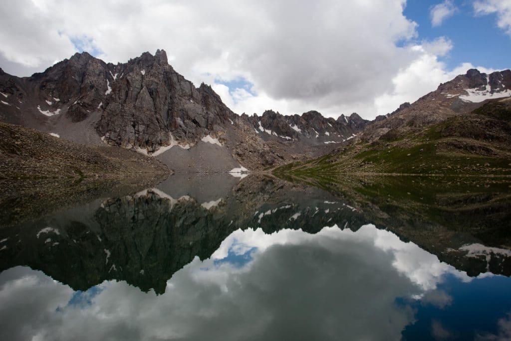Mountain reflection on the Boz Uchuk Lakes of Kyrgyzstan