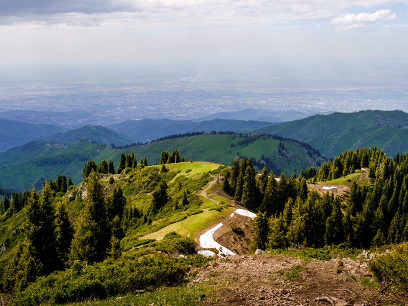 Swing in the distance with Almaty in background