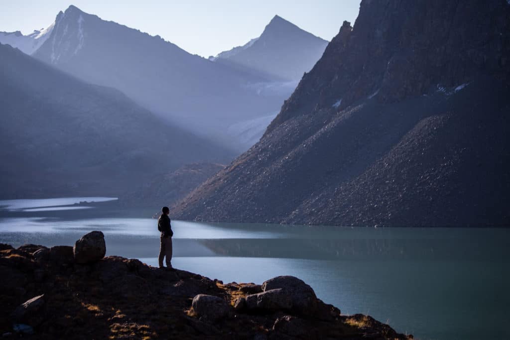 Hiker in profile above Alakol Lake